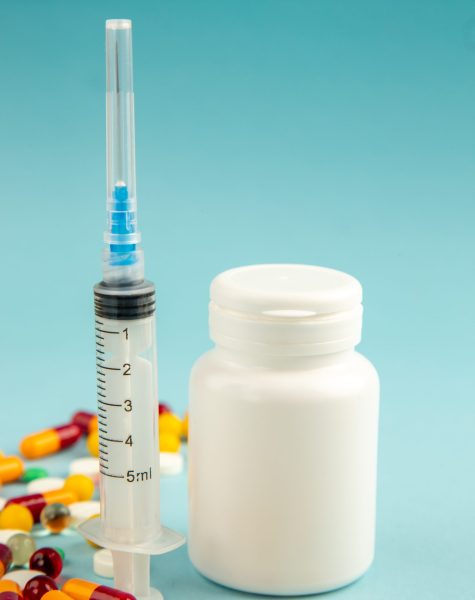 front-view-different-pills-with-vaccine-injection-blue-surface-virus-lab-health-covid-hospital-pandemic-color-science-drug (1)